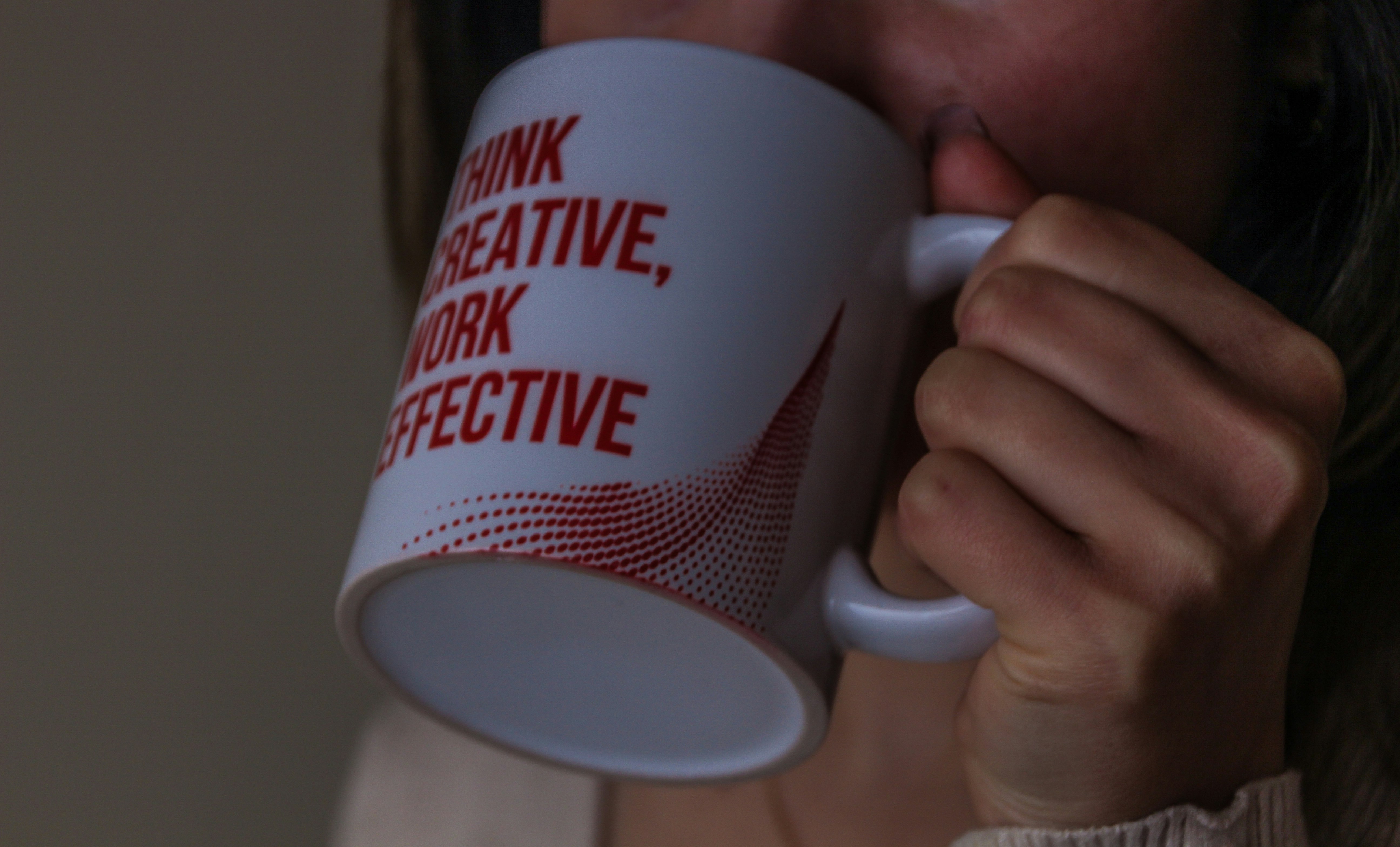 white and red ceramic mug