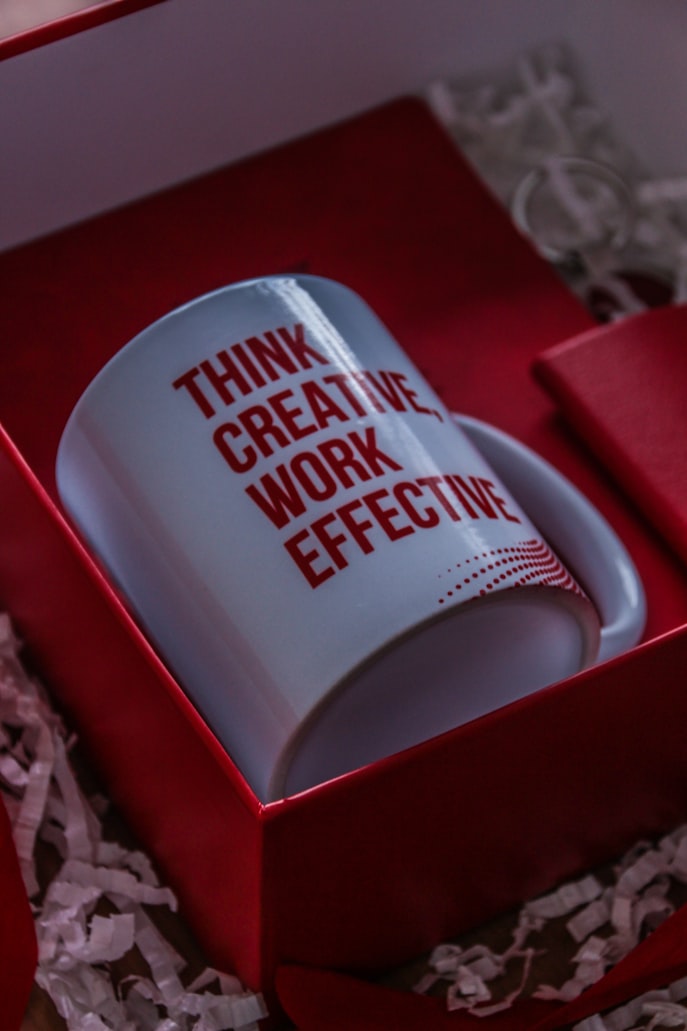 A mug with the words 'think creative, work effective'.