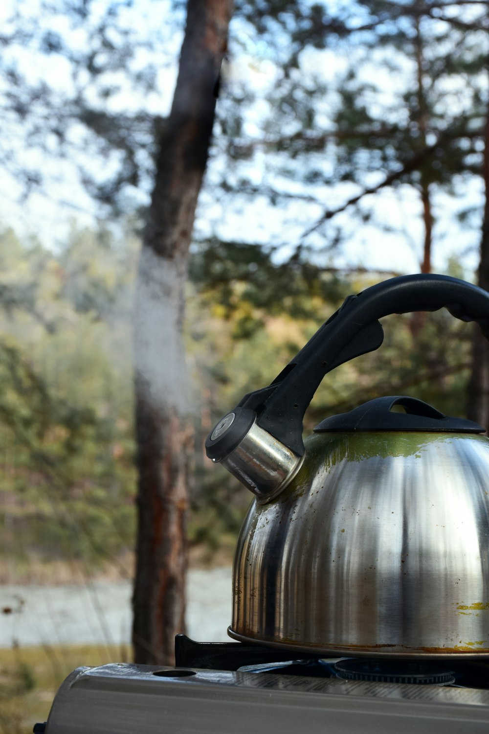 gold kettle on brown wooden table