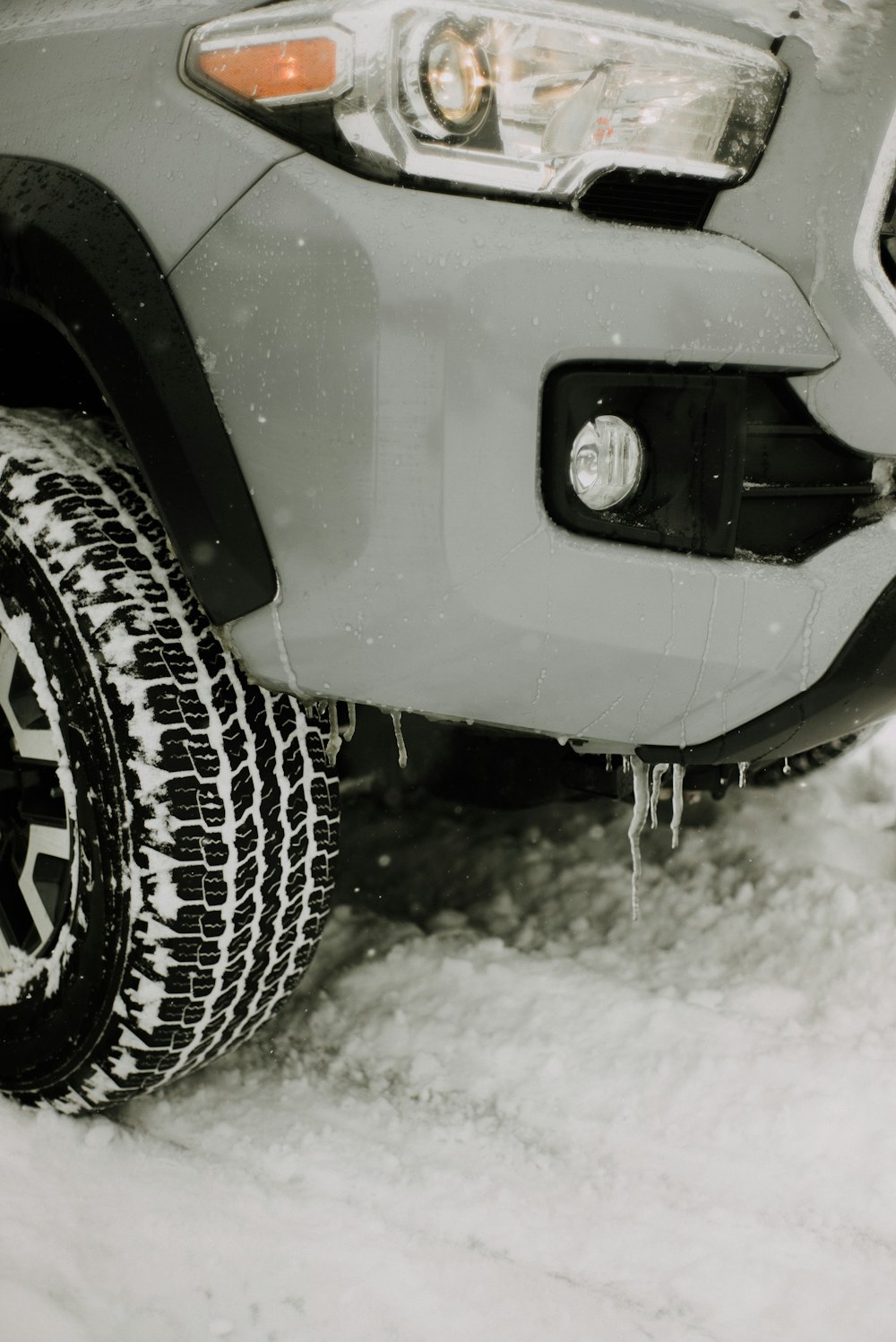 grey car with black tire