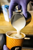 A close-up of a customizable coffee drink being prepared.
