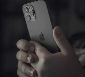 person holding silver iphone 6