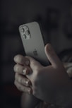 person holding silver iphone 6