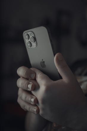 person holding silver iphone 6