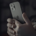 person holding silver iphone 6