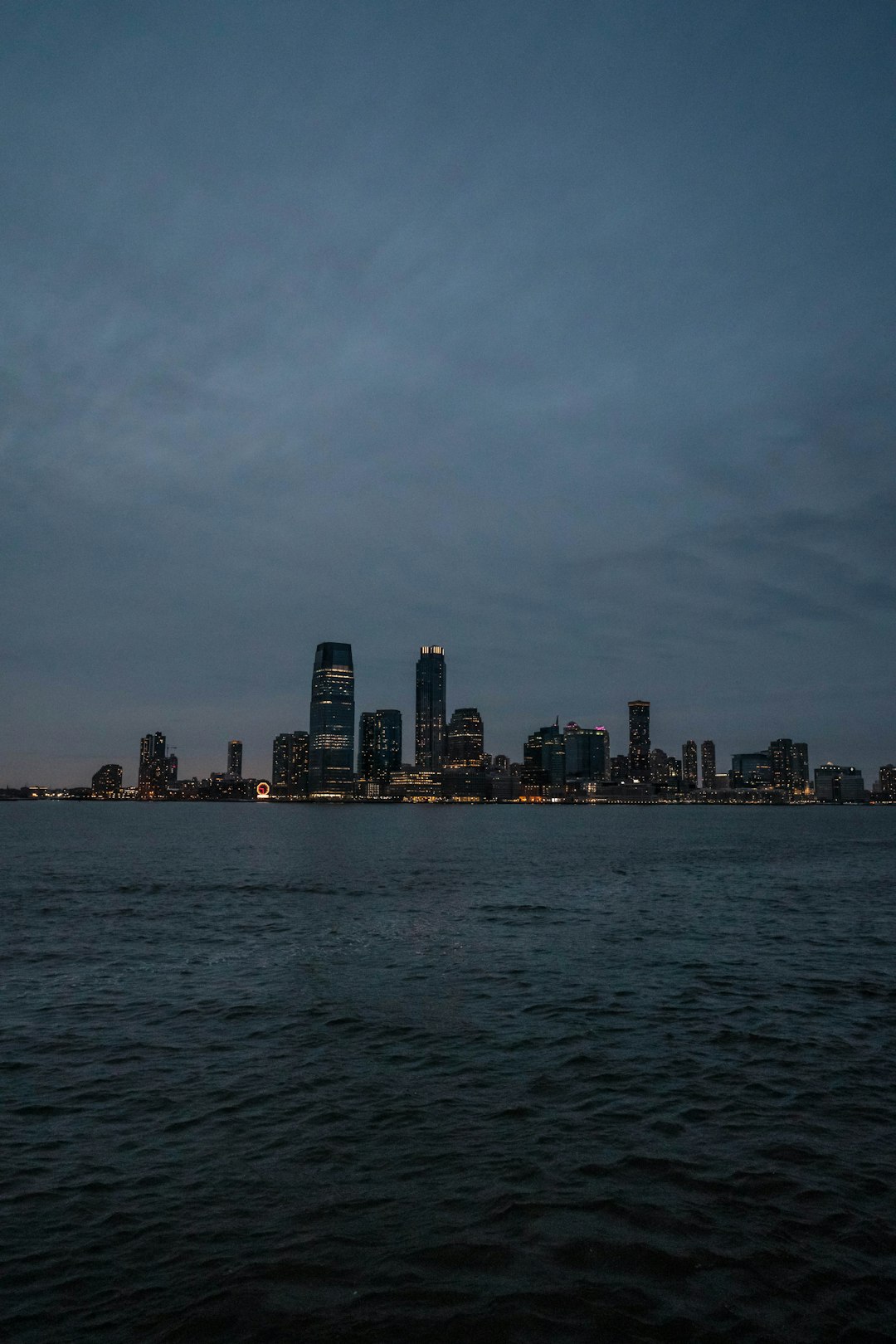 city skyline across body of water during daytime