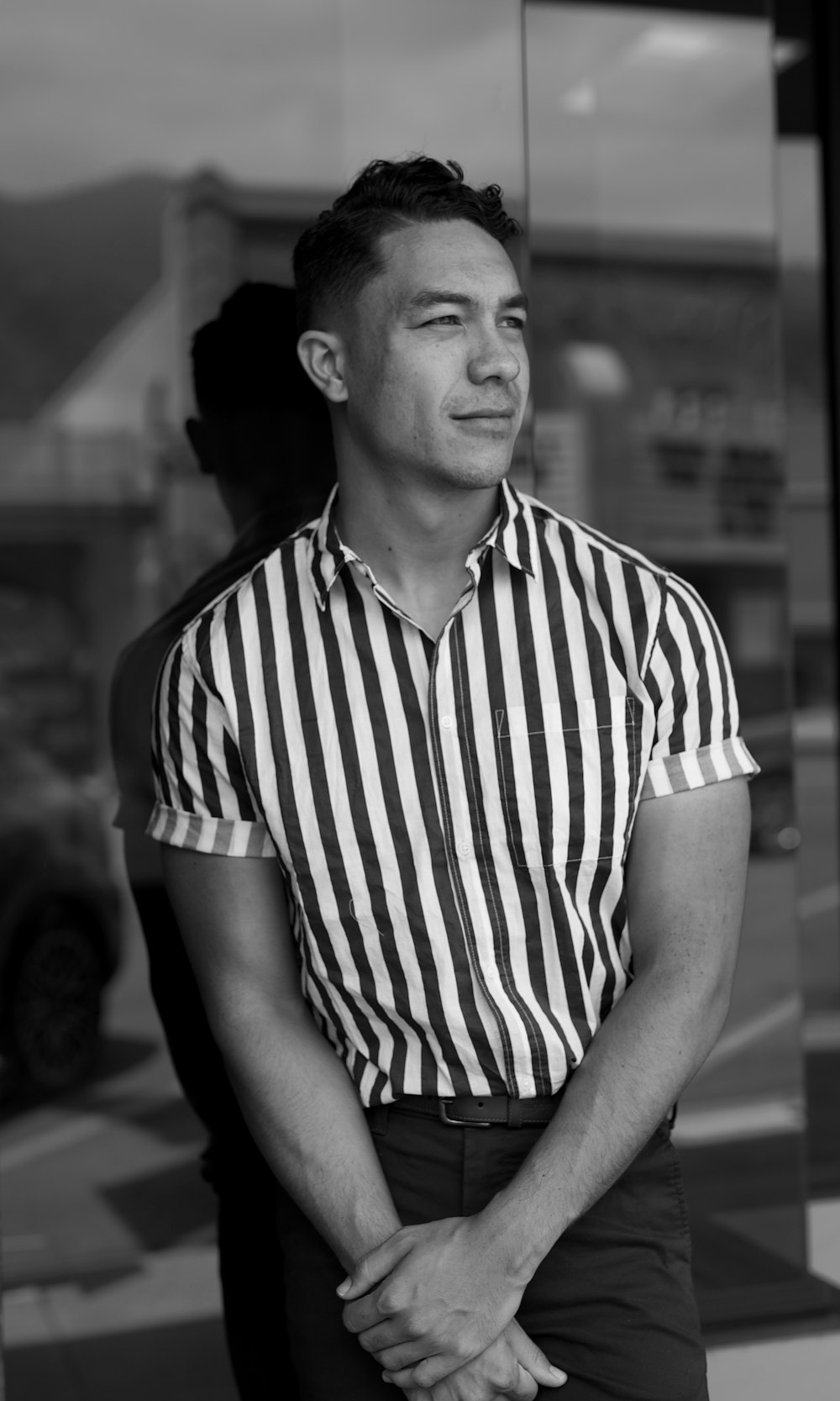 man in stripe polo shirt