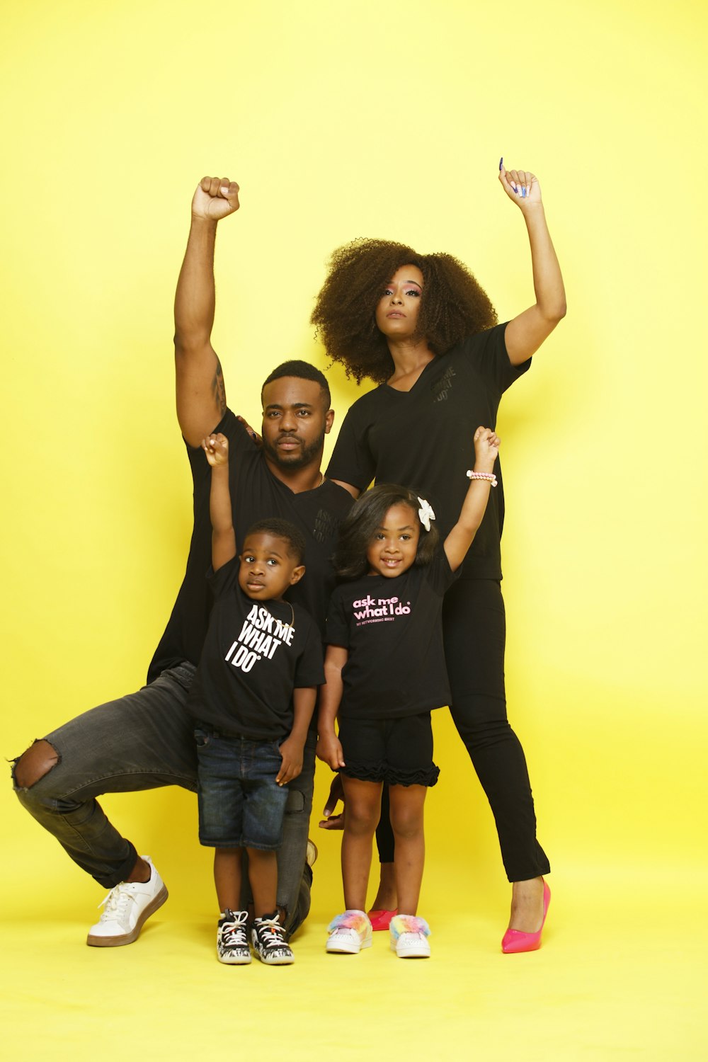 3 women in black t-shirt and blue denim jeans