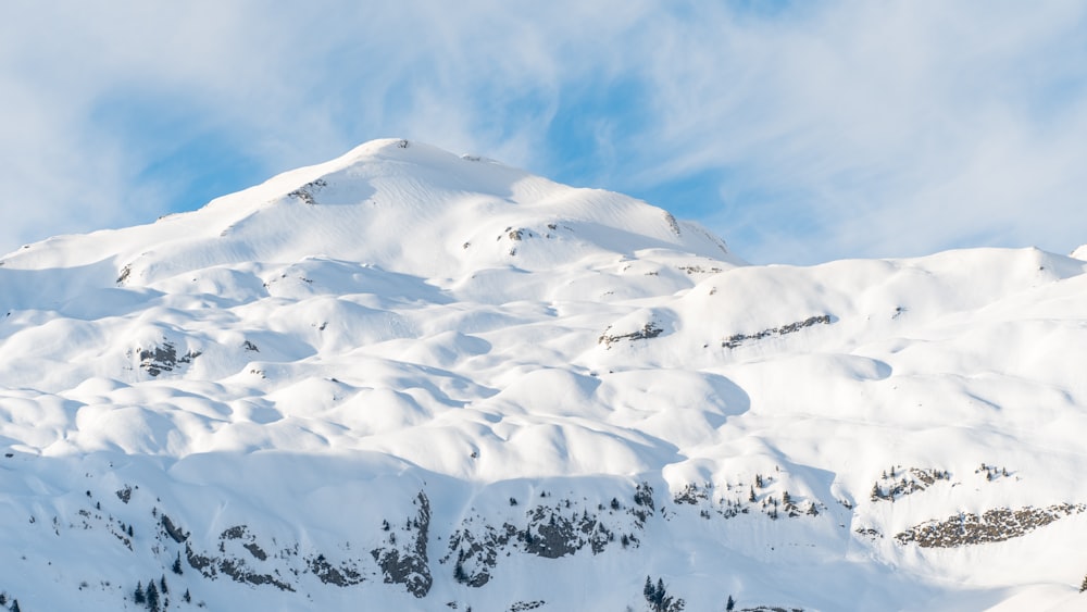 snow covered mountain under blue sky during daytime