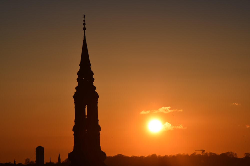 silhouette of building during sunset