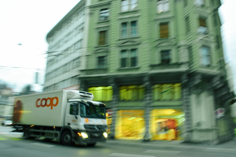 white bus on road during daytime