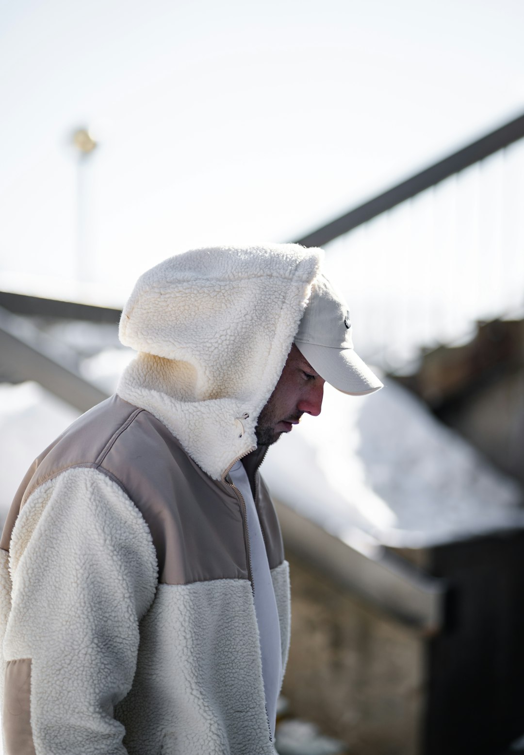 person in gray hoodie wearing white knit cap