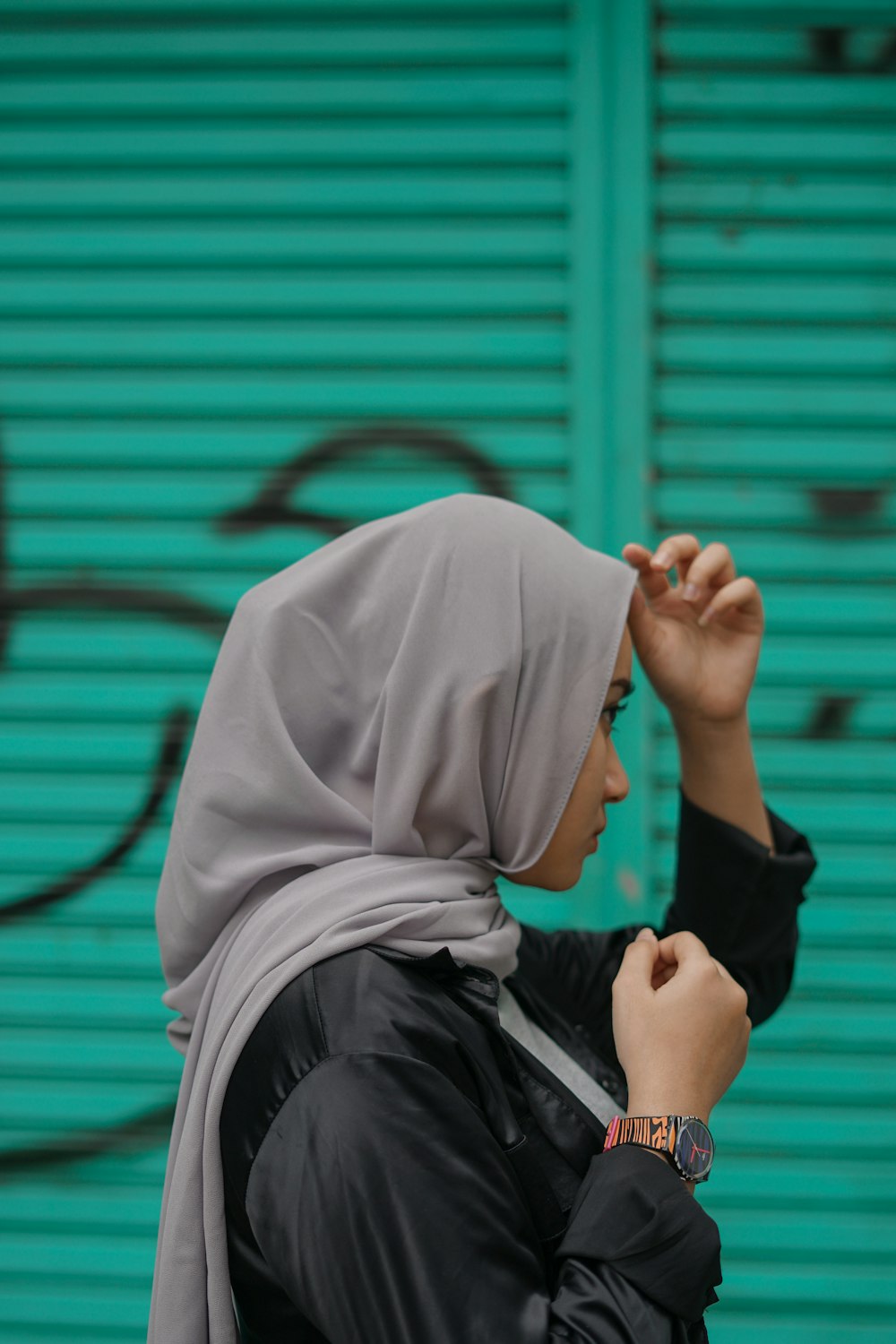 person in white hijab and black long sleeve shirt