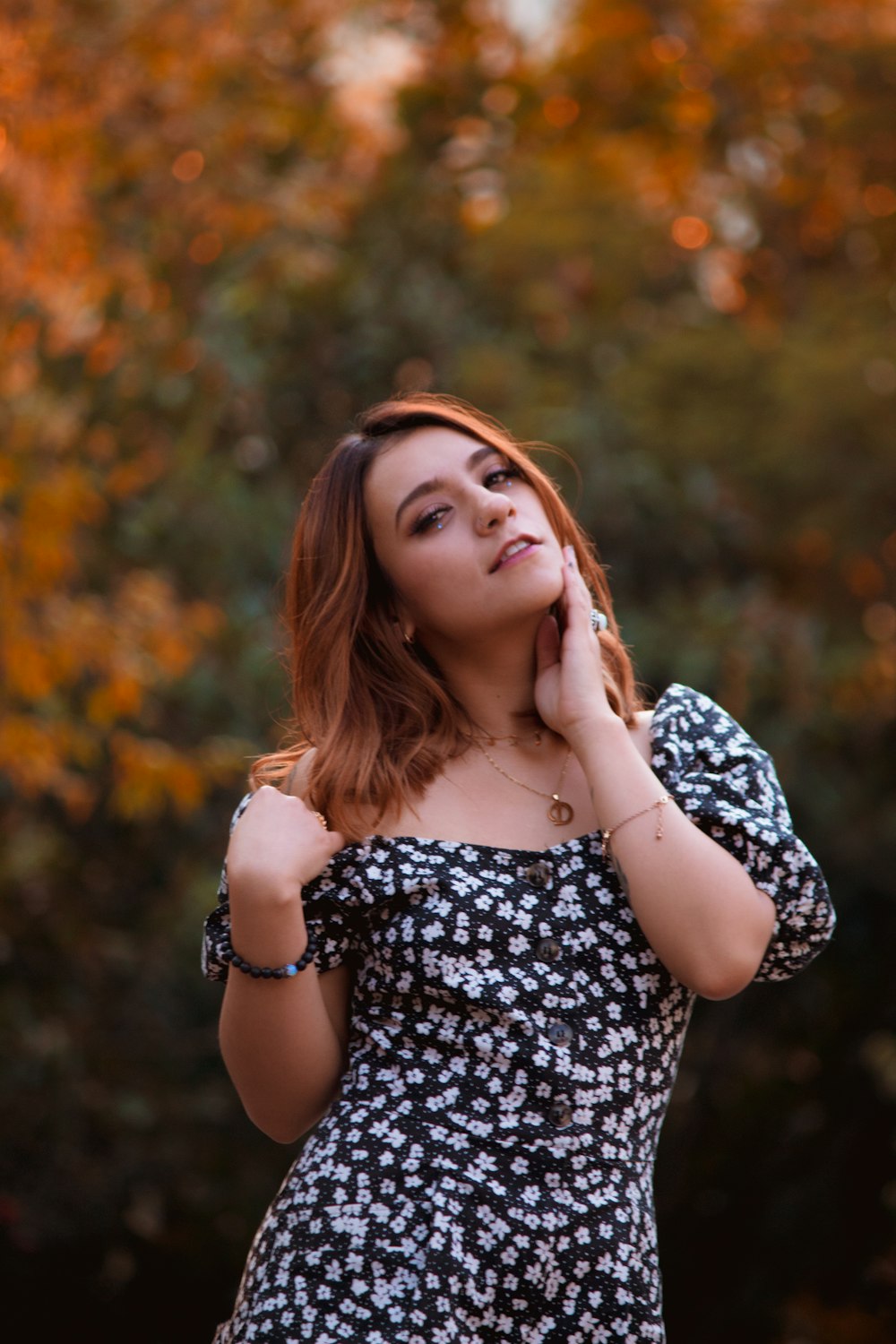 woman in black and white floral off shoulder dress