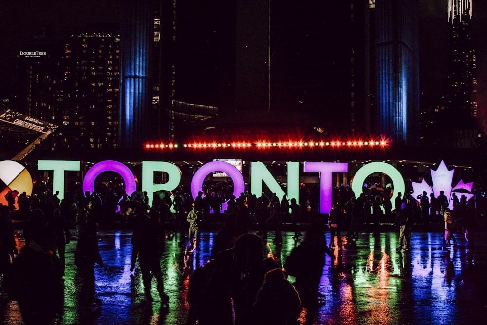 people walking on street during nighttime