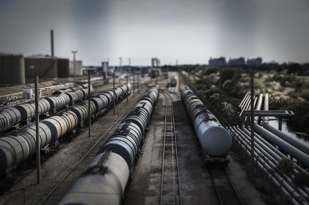 gray metal pipe on train rail during daytime