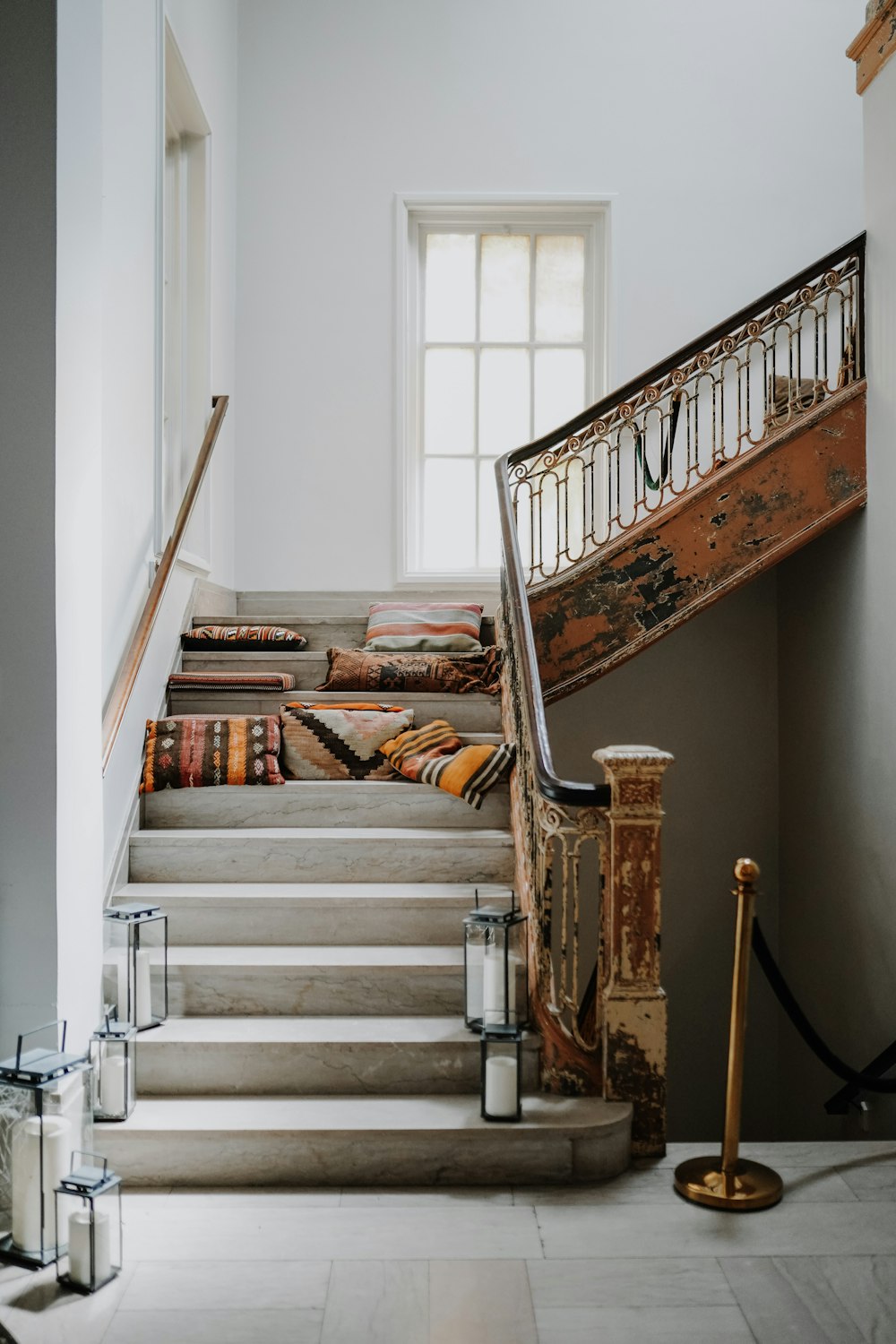 brown wooden staircase with books