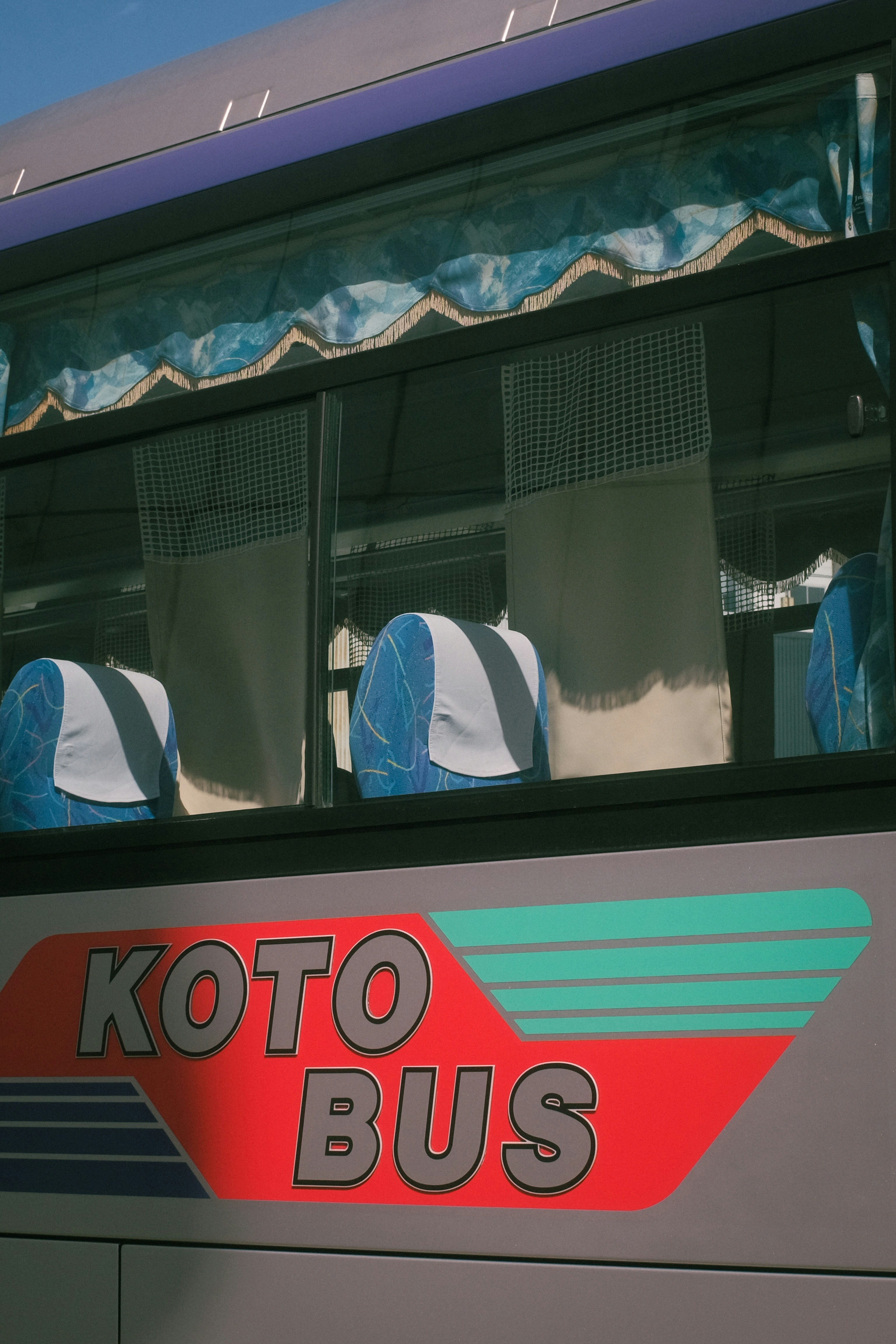 woman in white hijab sitting on train seat