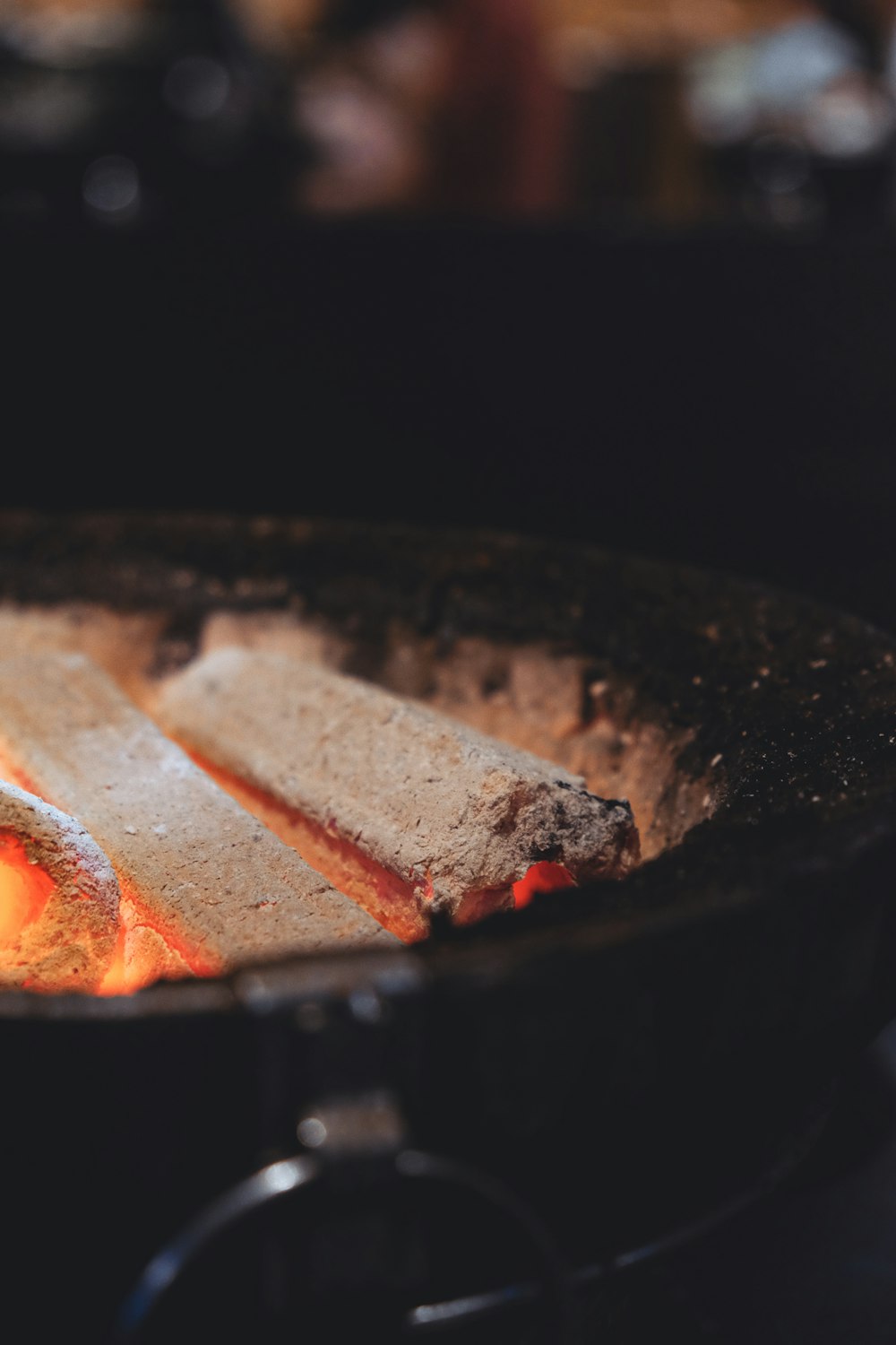 black round fire pit with fire