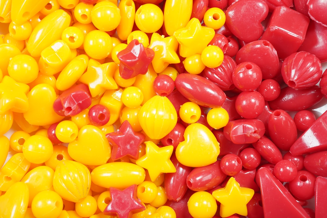 yellow and red candies on brown wooden table