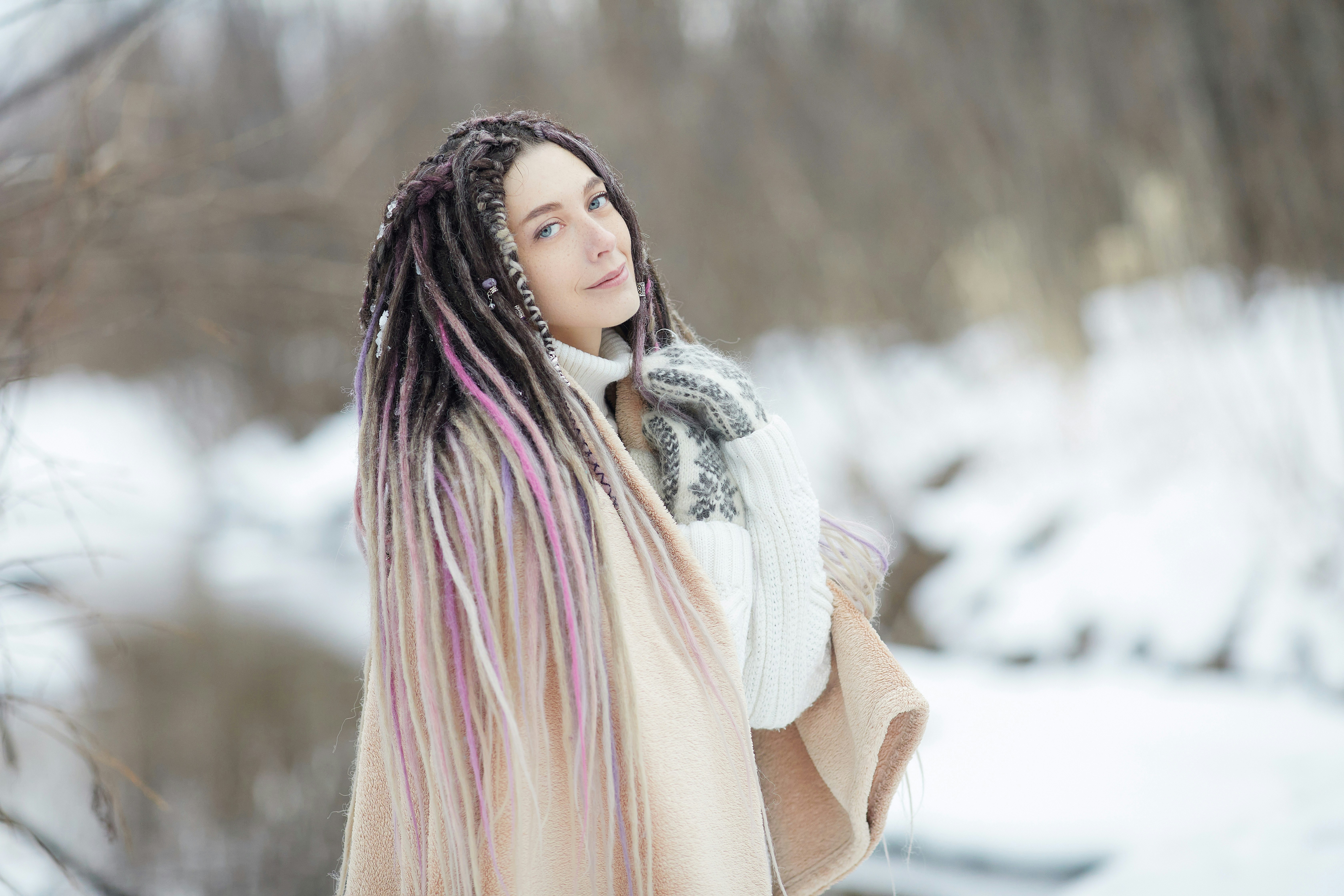 woman in white scarf and brown coat