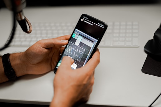 person holding black android smartphone