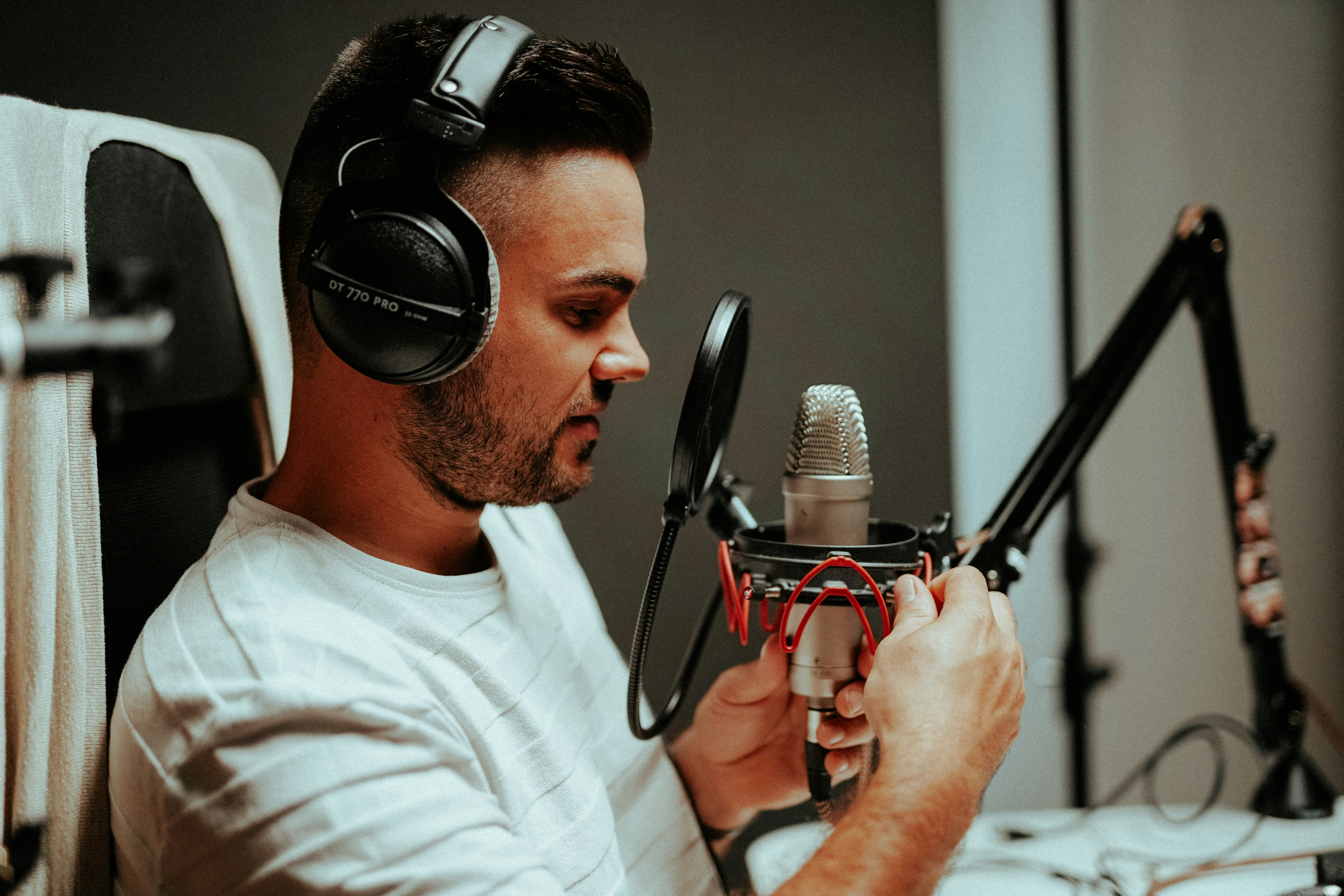 Malte Helmhold, a content marketer preparing to create content in front of a professional podcaster microphone