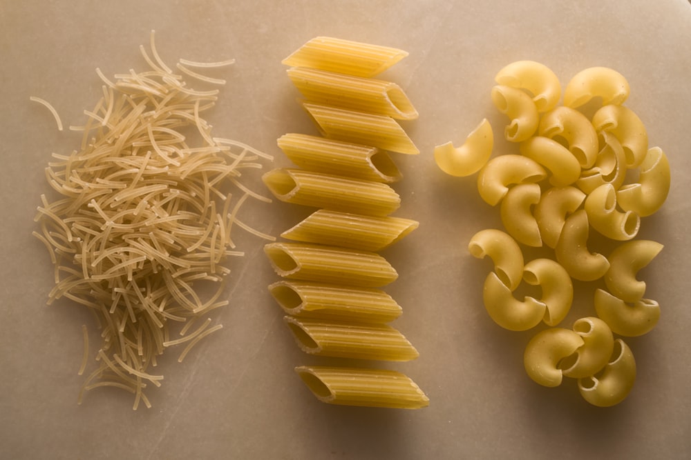 yellow pasta on white table