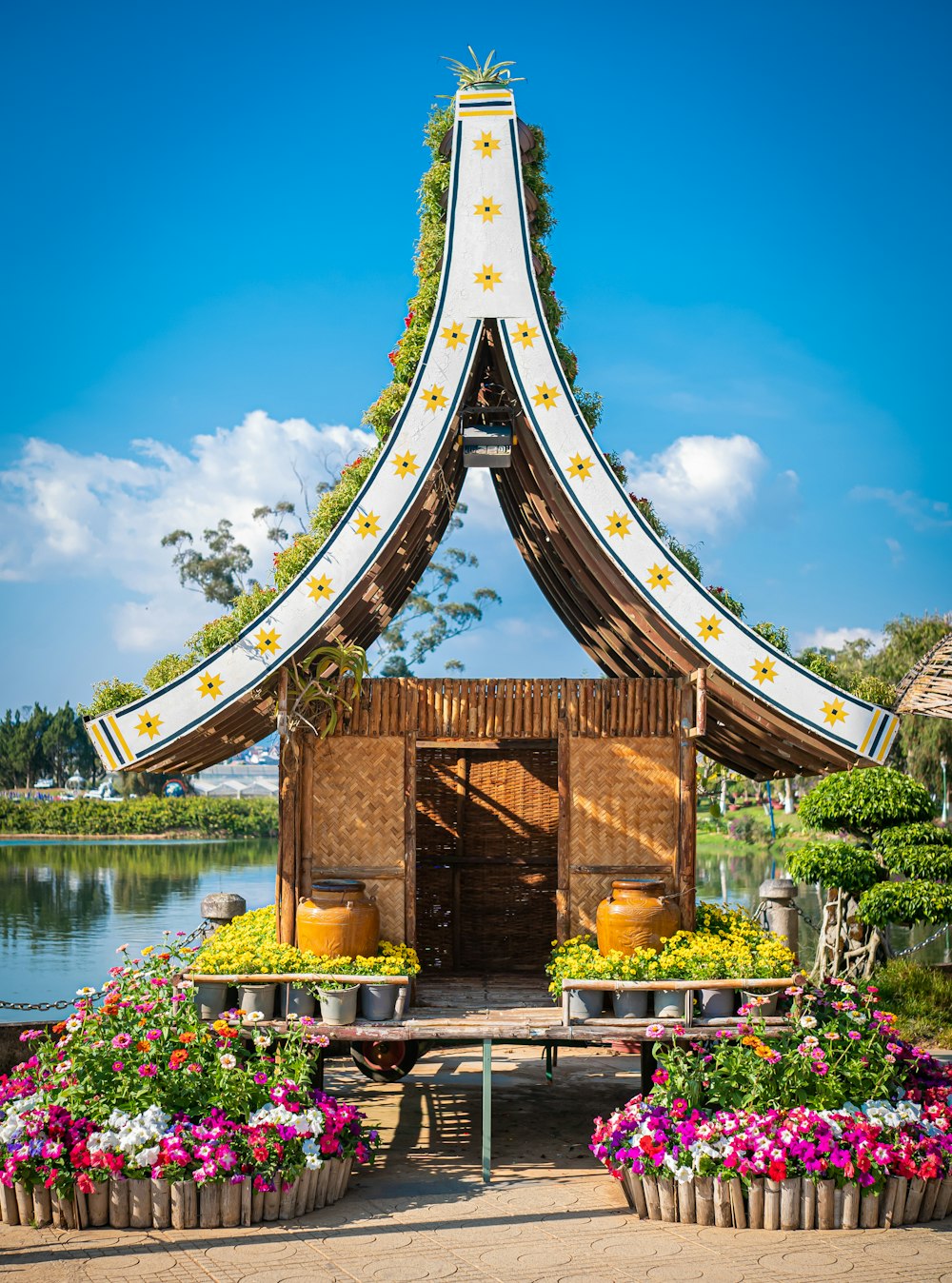 brown and gold temple near body of water during daytime