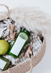 green iphone 5 c on white textile