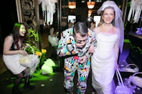 A joyful celebration scene with people enjoying fruit juices at a wedding.
