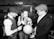 A team of professionals discussing logistics with charts and a globe.