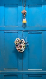 A handyman painting a fresh coat on a front door.