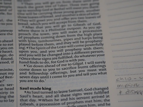 Close-up of open book pages filled with handwritten philosophical notes.