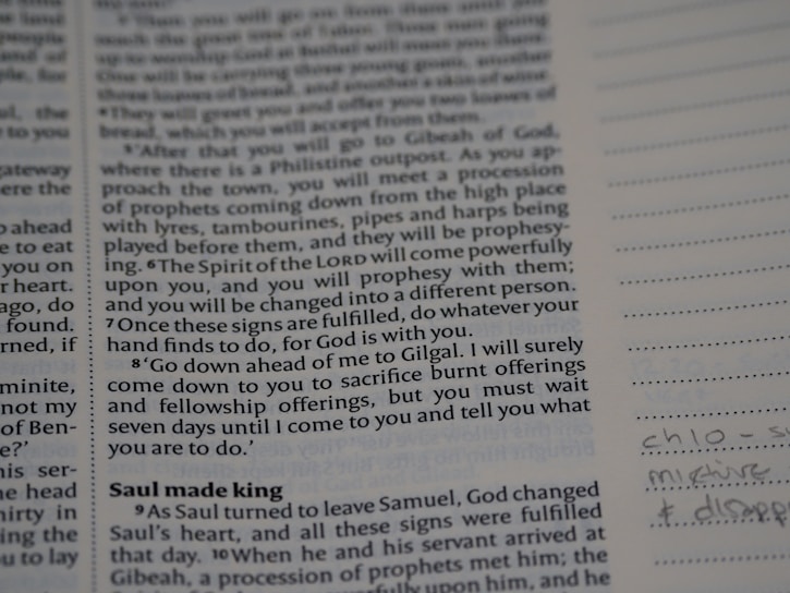 A close-up of an open book with handwritten notes on Islamic philosophy.