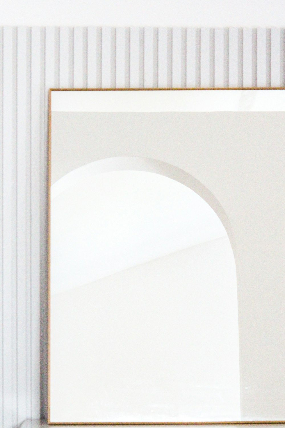 brown wooden frame on white wall