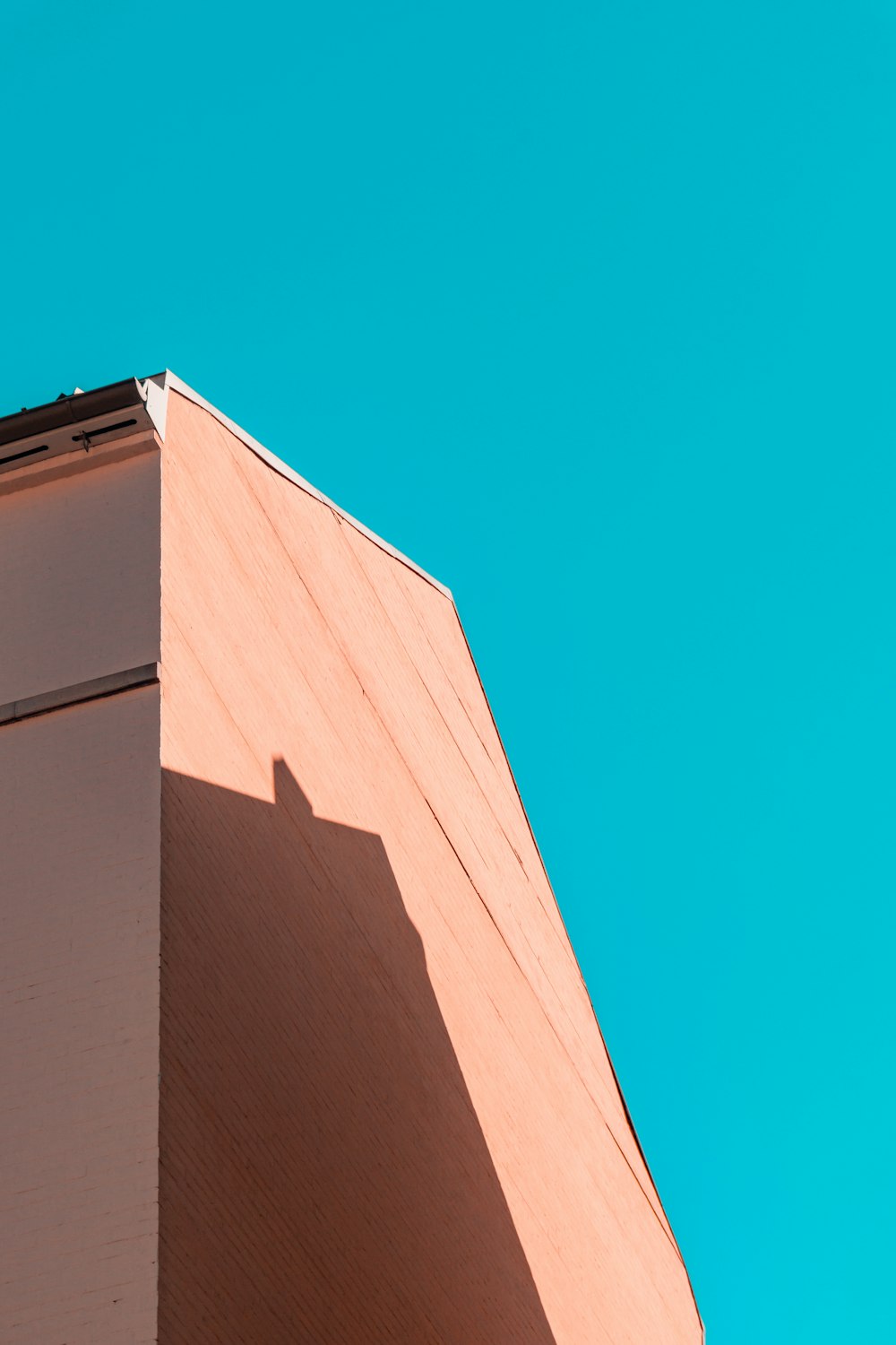 brown concrete building under blue sky during daytime