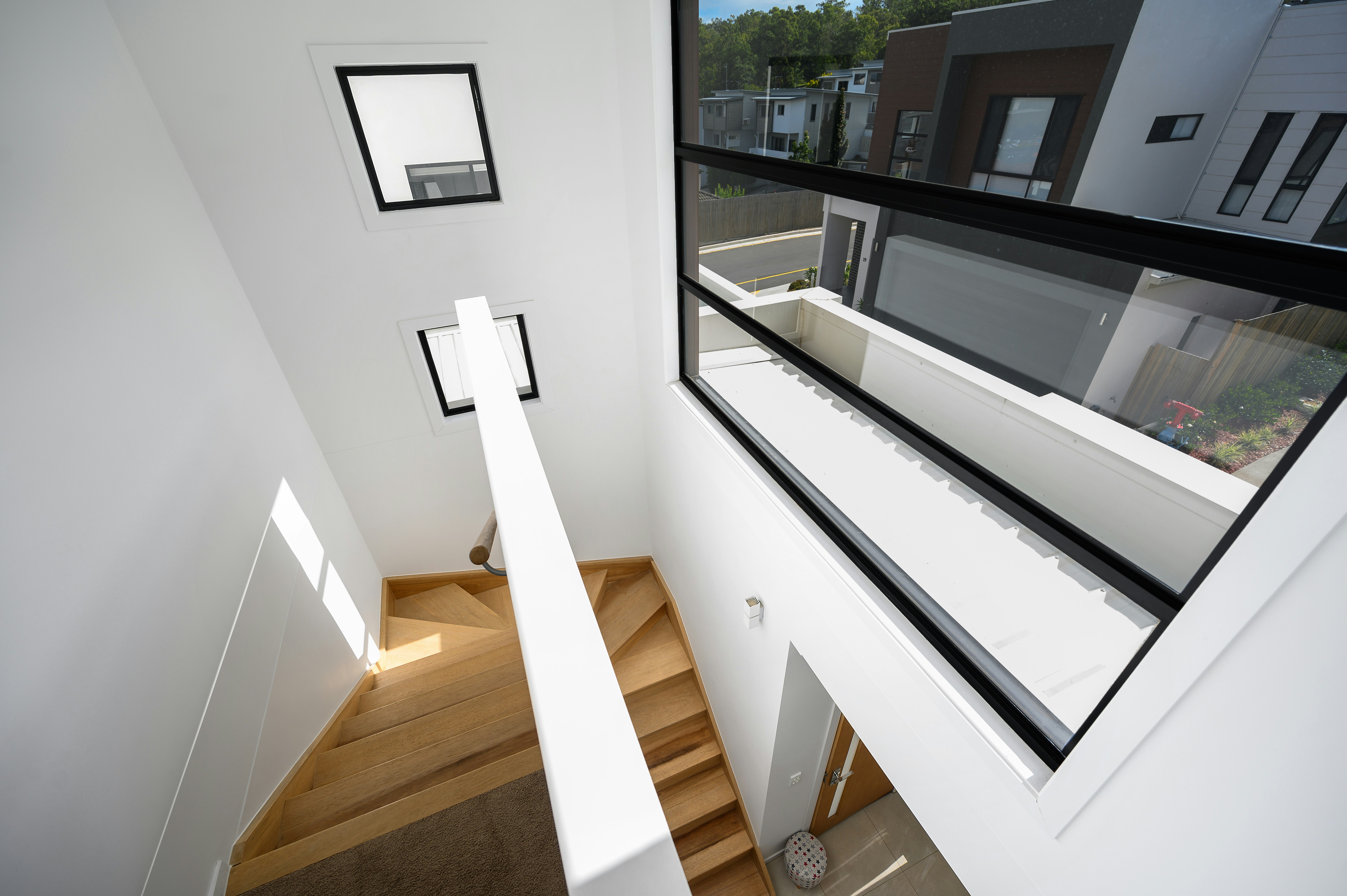 white wooden cross on white wall