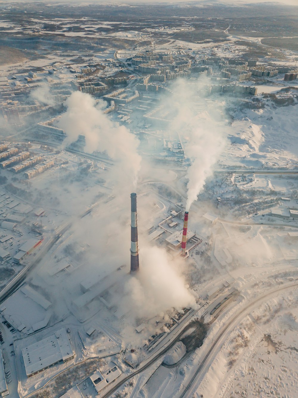 aerial view of city with smoke