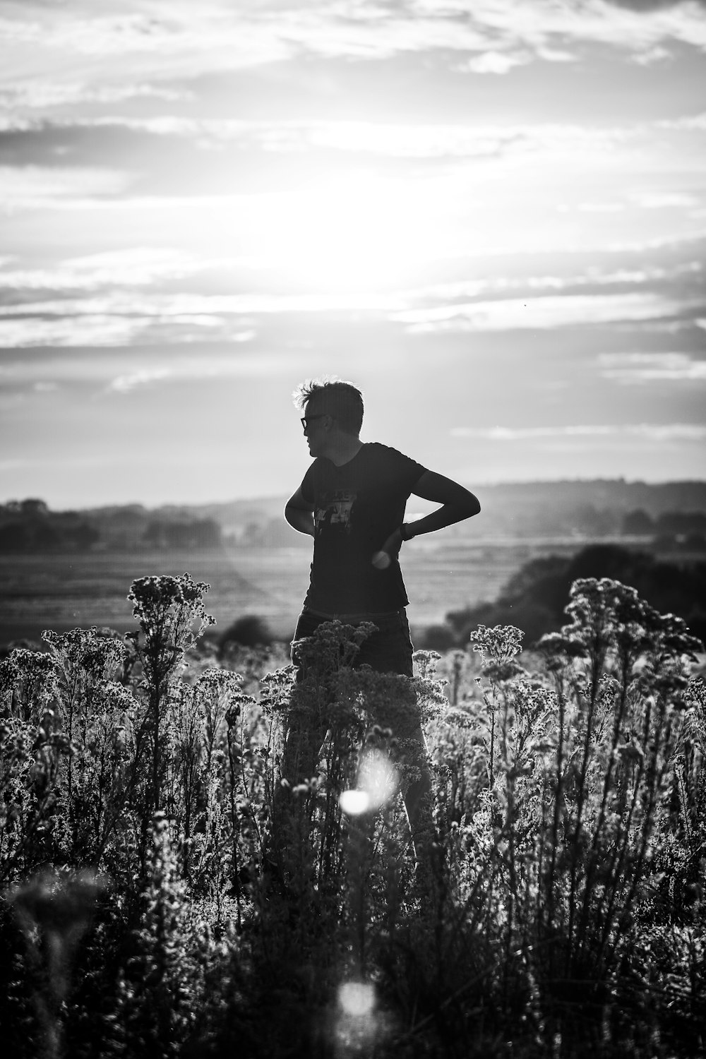 grayscale photo of man playing with water