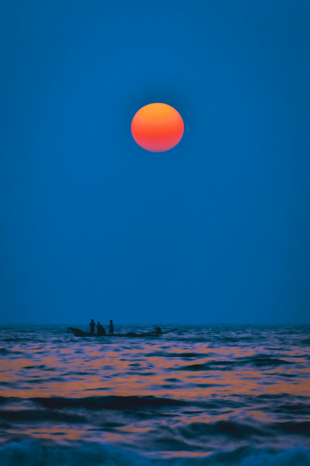 people on beach during sunset