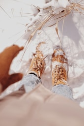 person in brown and white shoes