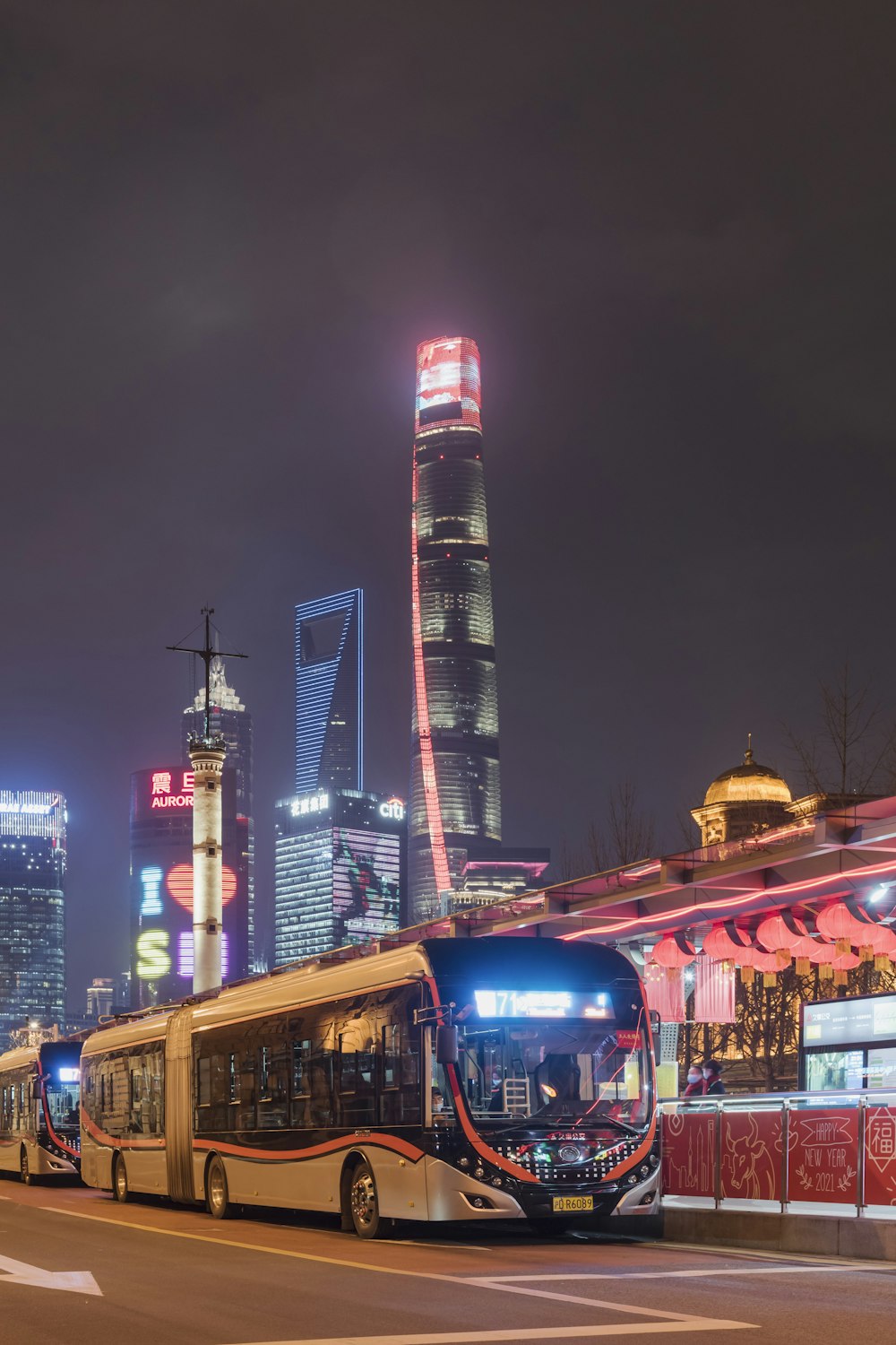 city buildings with lights turned on during night time