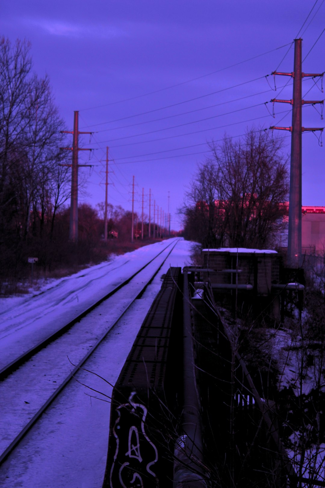 snow covered train rail during daytime