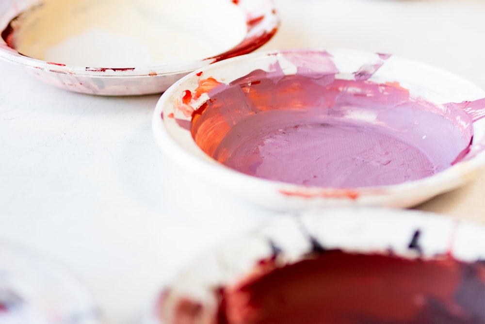 white and red ceramic bowl