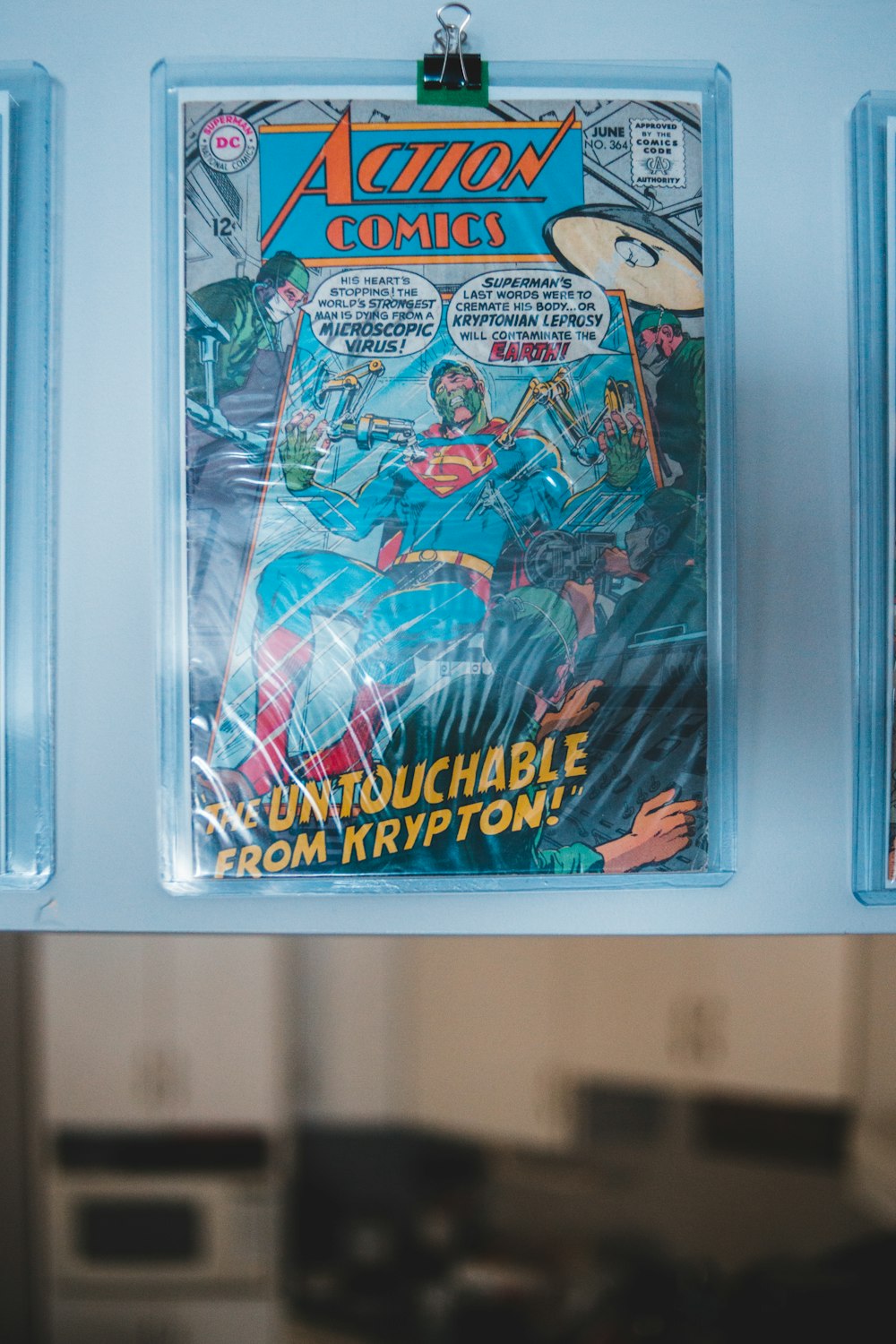 a close up of a comic book hanging on a wall