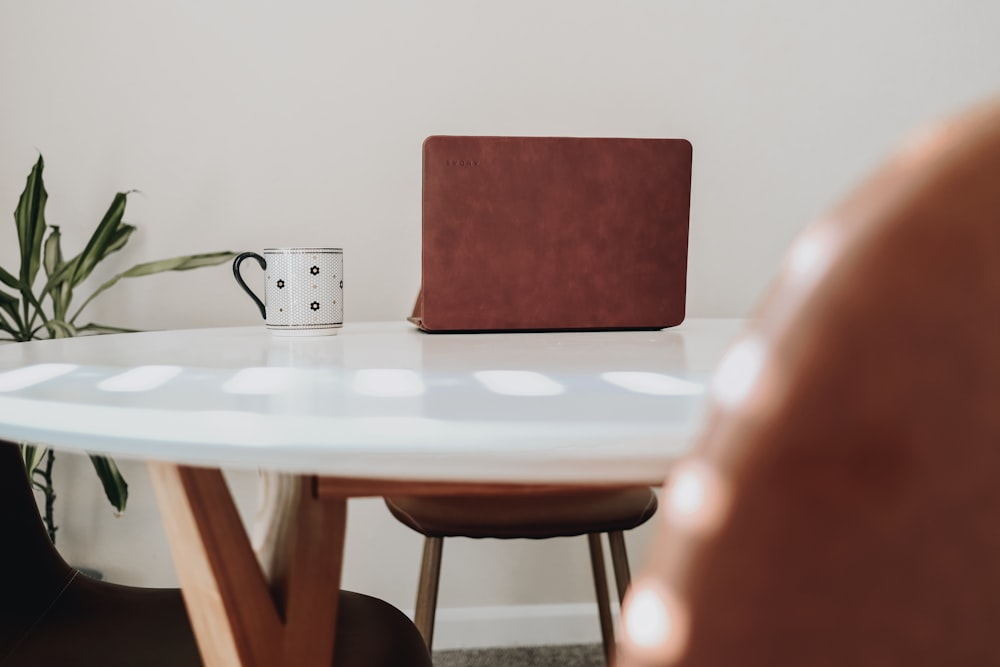 red chair beside white table