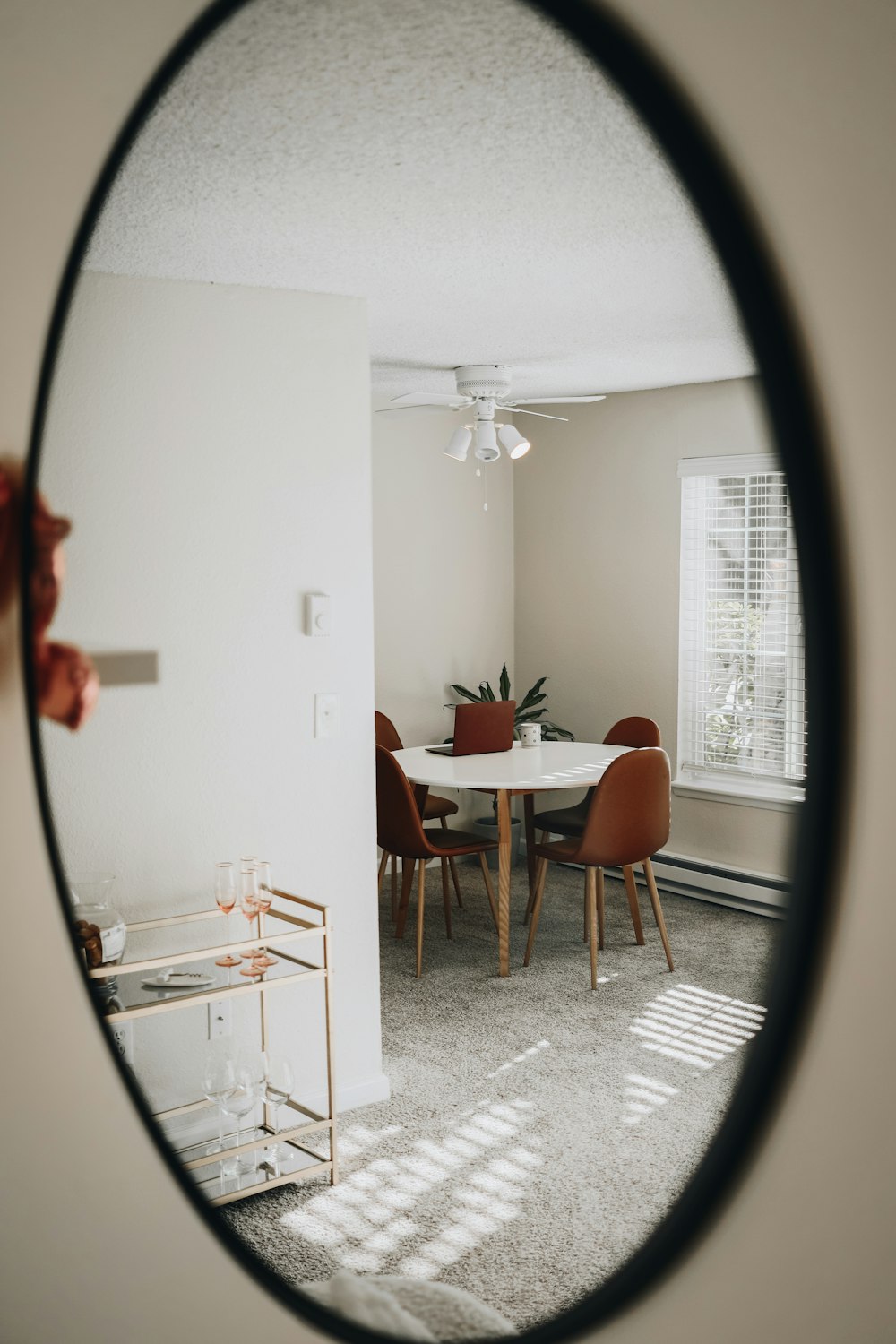 white wooden cabinet near brown wooden chair