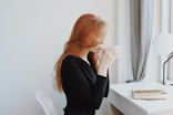 woman in black long sleeve shirt sitting on chair