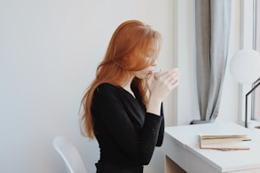 woman in black long sleeve shirt sitting on chair